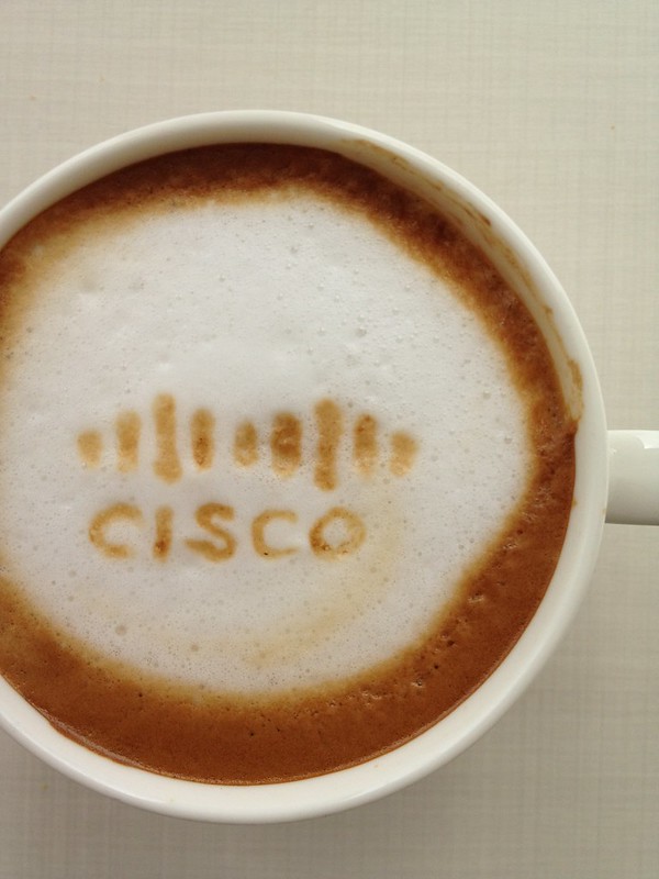 Cisco logo imprinted in coffee foam.