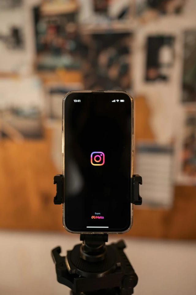 A phone on a tripod filming Instagram content.