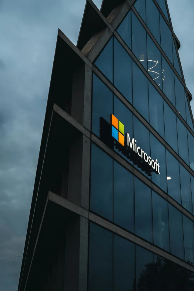 The Microsoft logo displayed outside an office building. 