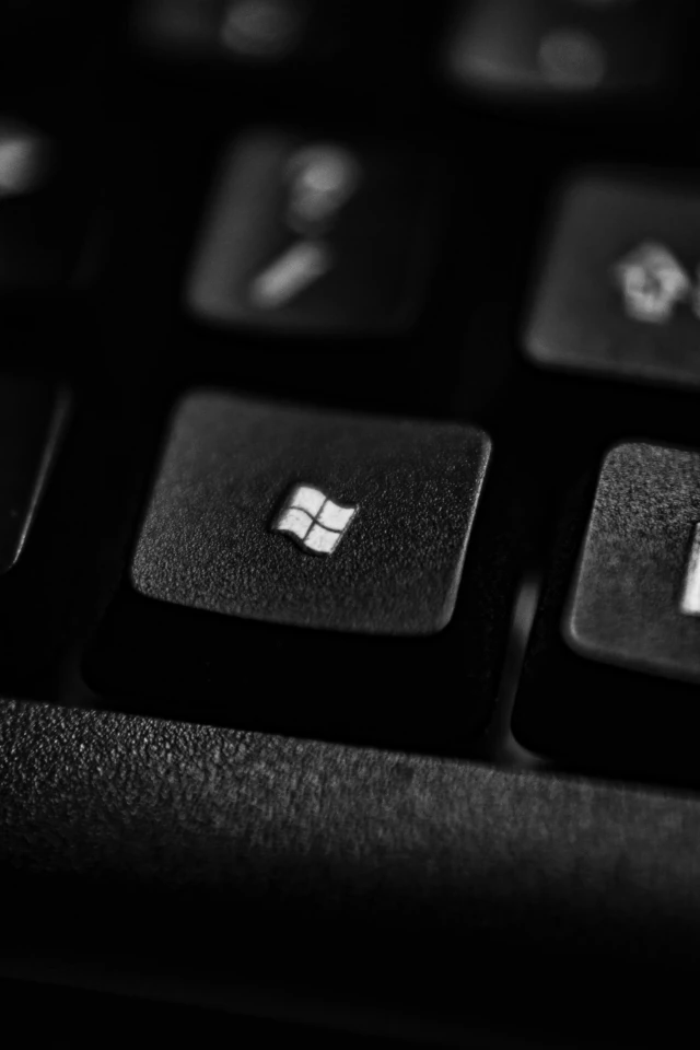 The Microsoft Windows logo displayed on a keyboard's function key. 