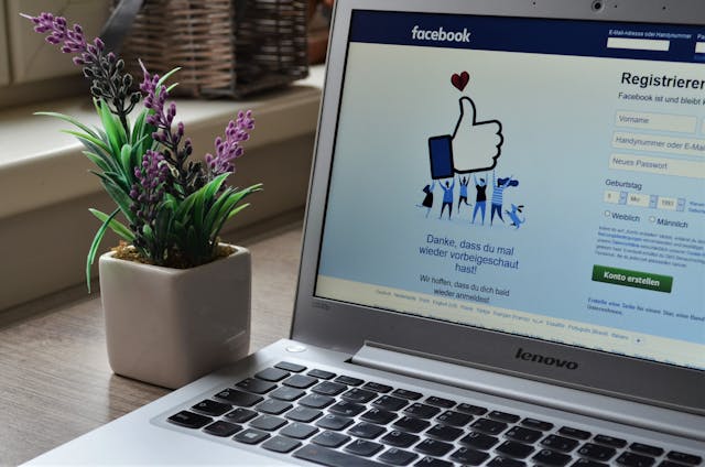 A laptop PC with Facebook on the screen. 