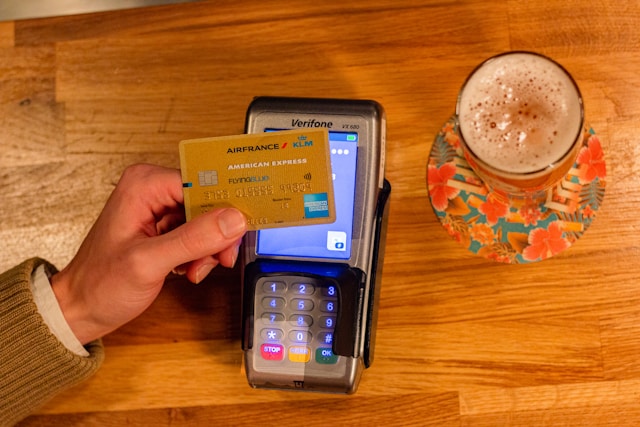 American Express card paying for a glass of beer. 