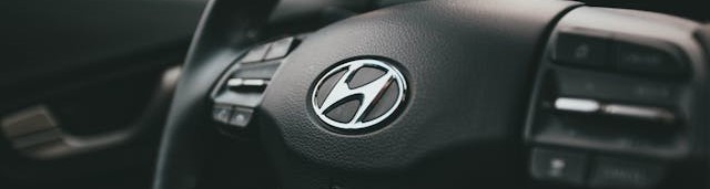 Hyundai logo on a car steering wheel.