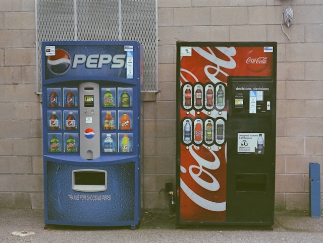 Pepsi and Coke vending machines. 