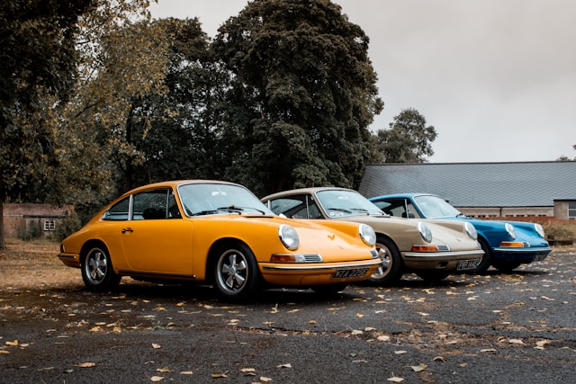 A row of vintage Porsche sports cars.