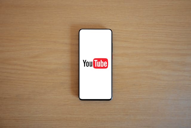 YouTube logo displayed on a smartphone. 