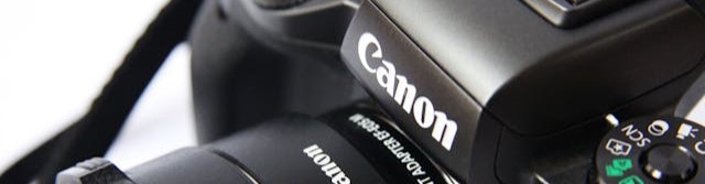 Canon logo on a DSLR camera.