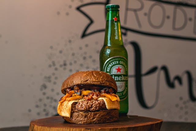 A Heineken bottle and a burger. 