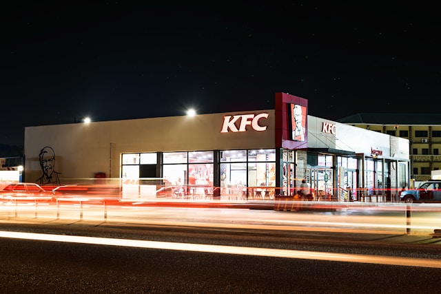 A KFC restaurant at night. 