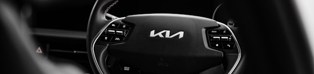 Kia logo on a steering wheel.