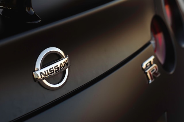 Nissan badge on car.