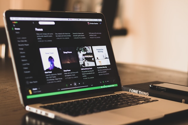 Spotify interface running on a laptop