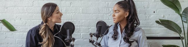 Two women recording a podcast