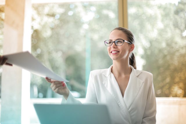 A business person sitting at a laptop. 