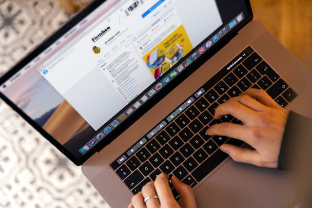 A person creating a marketing email on a laptop.