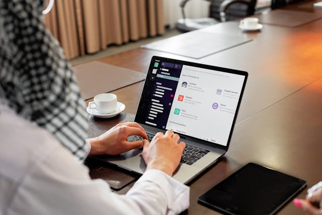 A person working on an email marketing campaign on a laptop. 