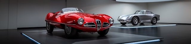 Two classic Alfa Romeo cars.