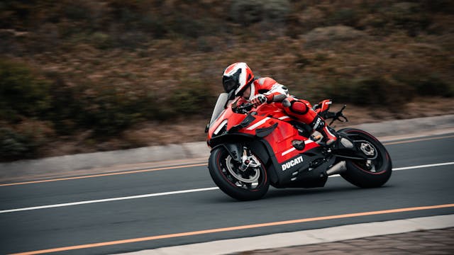 A Ducati sports motorcycle on the road.