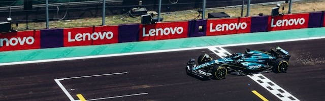 Lenovo logo on sidings at a Formula One race track.